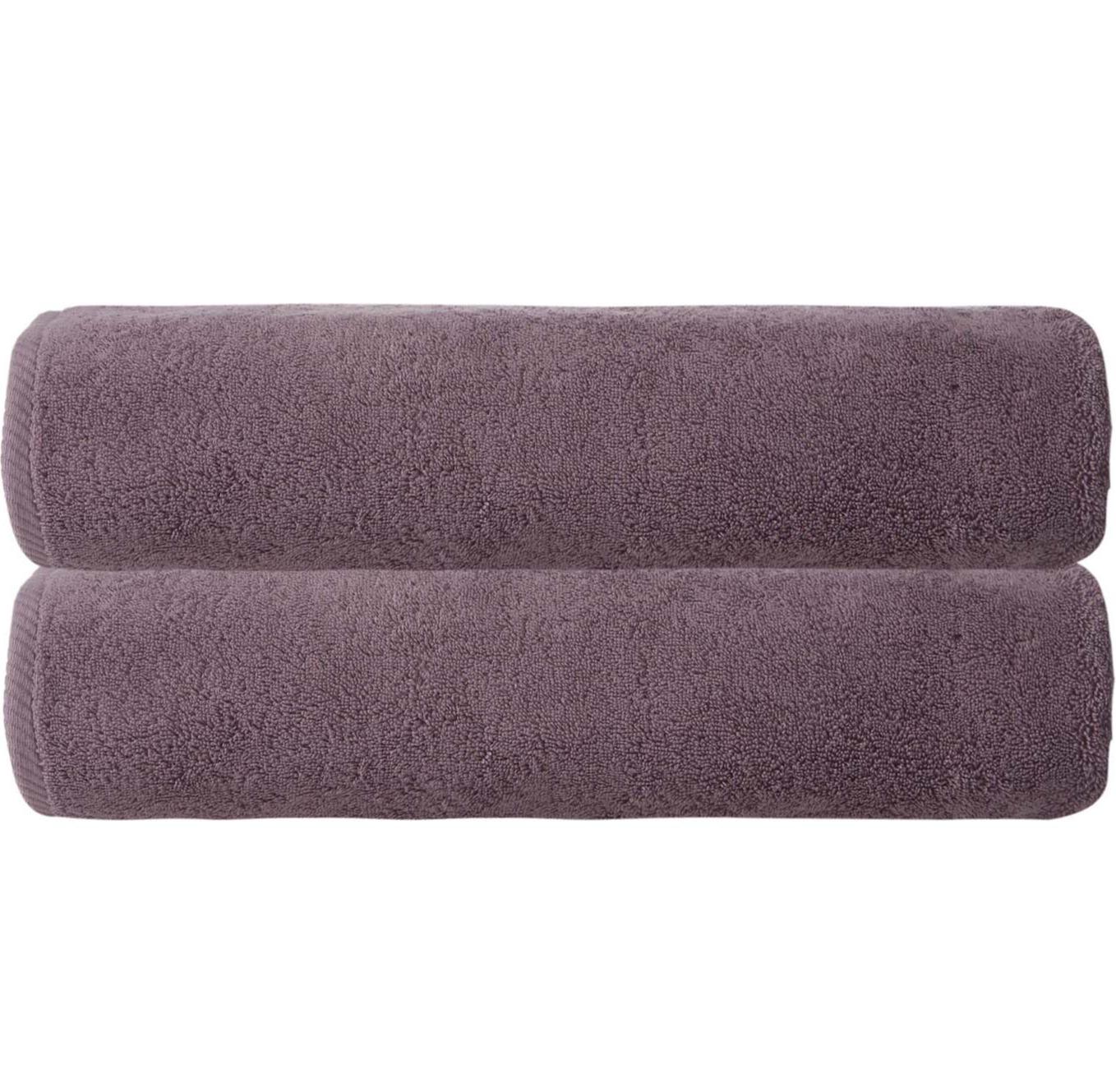 Purple bath sheets, two stacked folded towels with plush terry pile.