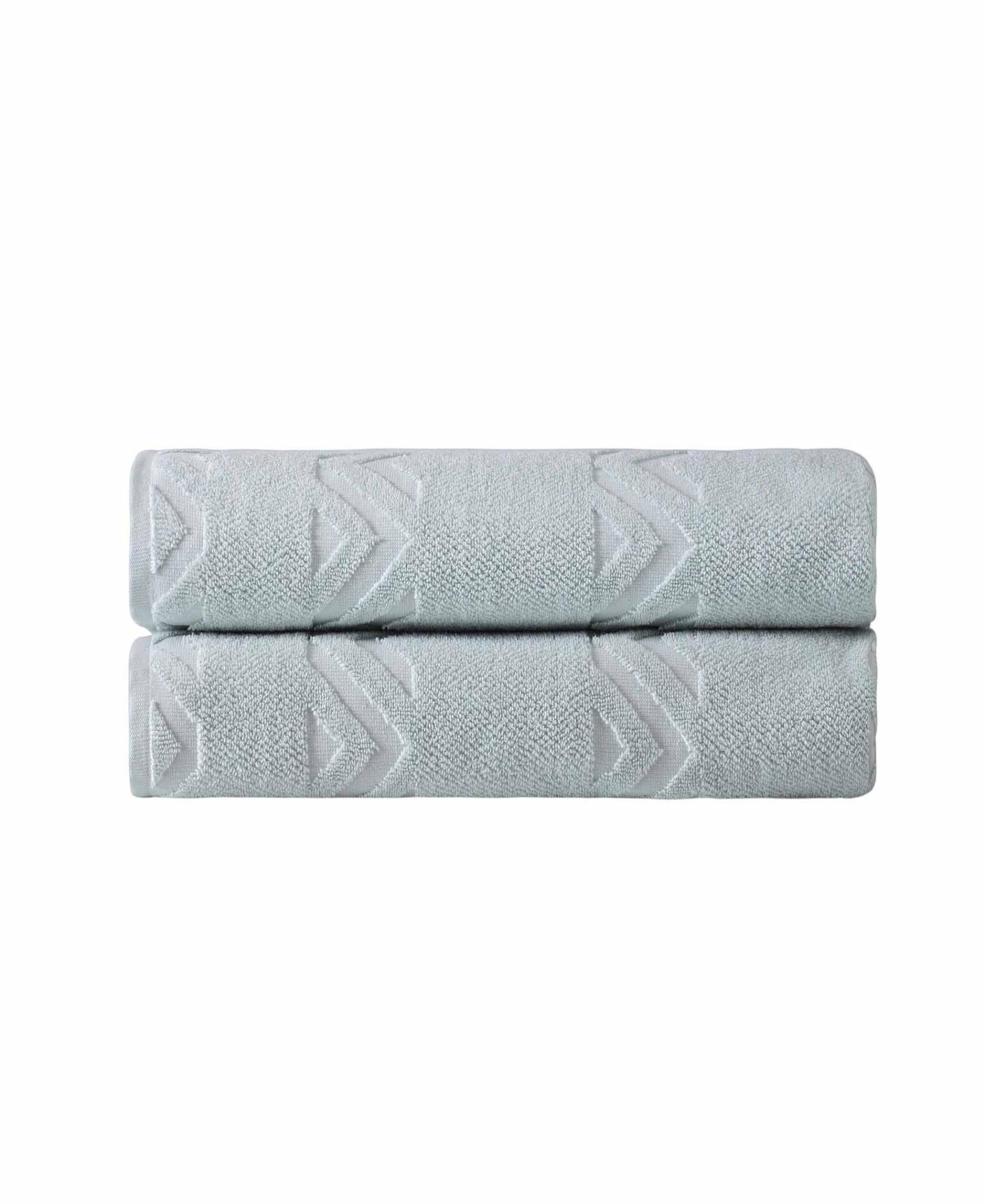 Aqua bath sheet folded with embossed chevron geometric pattern
