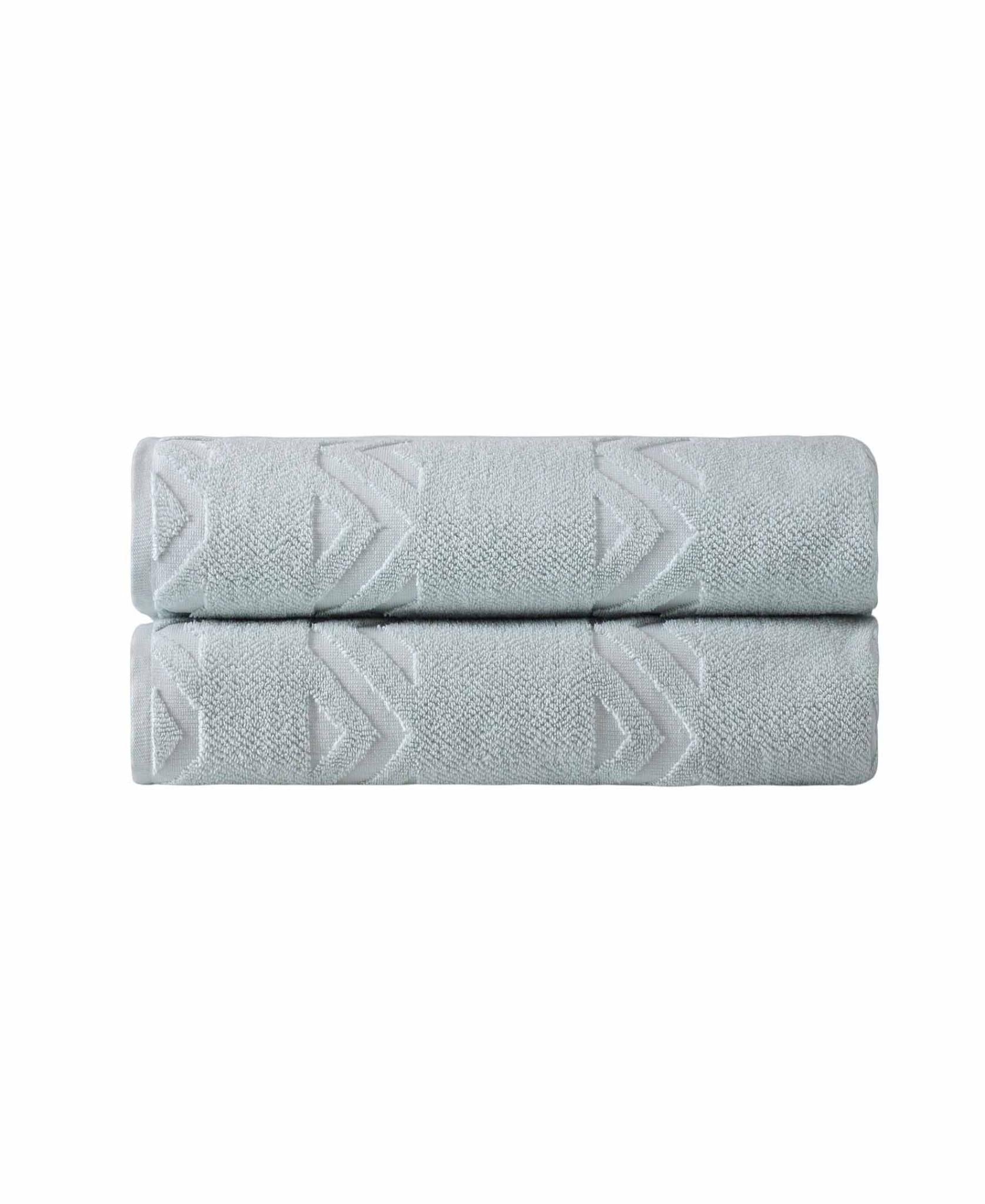 Set of two aqua Turkish cotton bath towels with white zigzag geometric pattern, folded