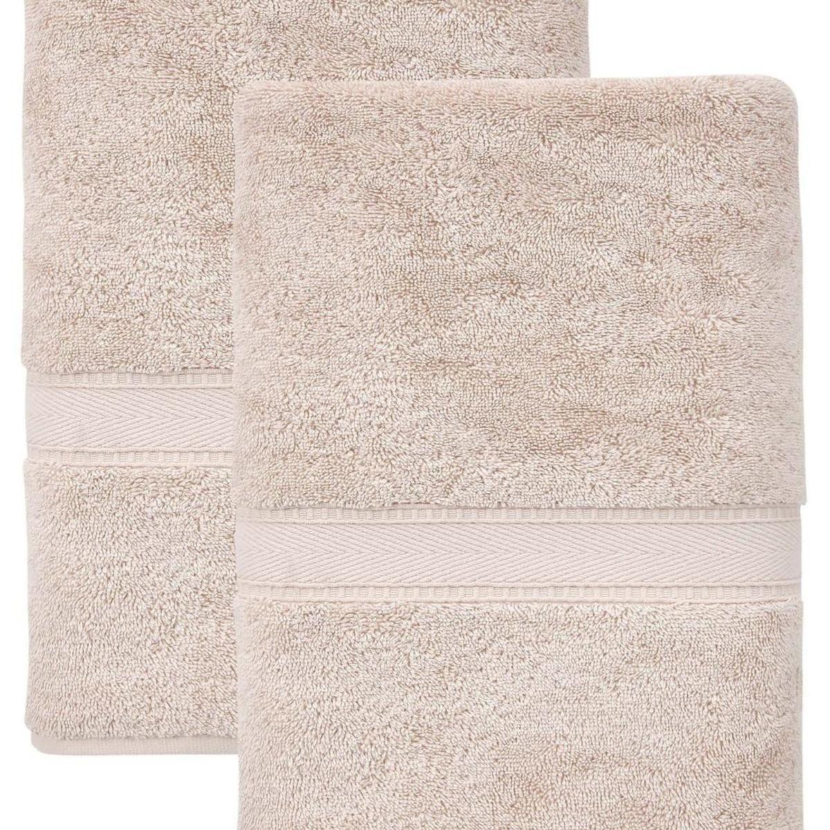 Set of two bath towels, light tan with woven texture and striped border bands.