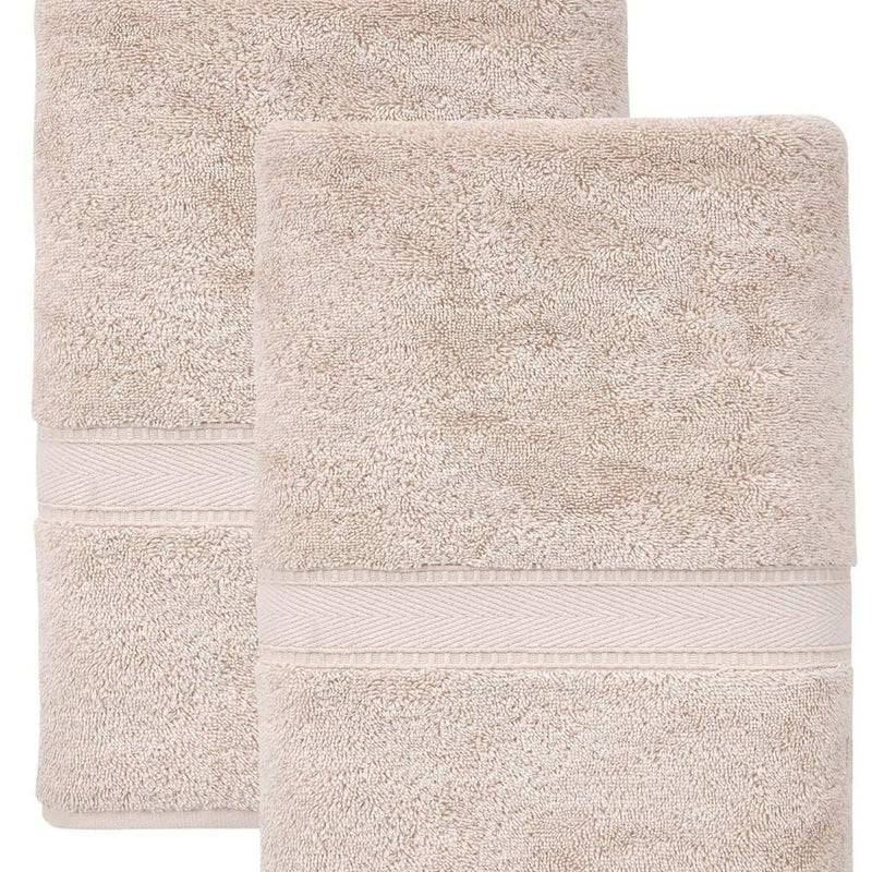 Set of two bath towels, light tan with striped border and stacked folded layout.