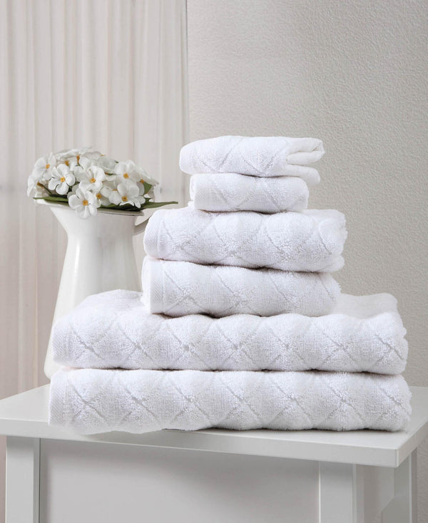 White Turkish cotton towel set with geometric pattern, stacked