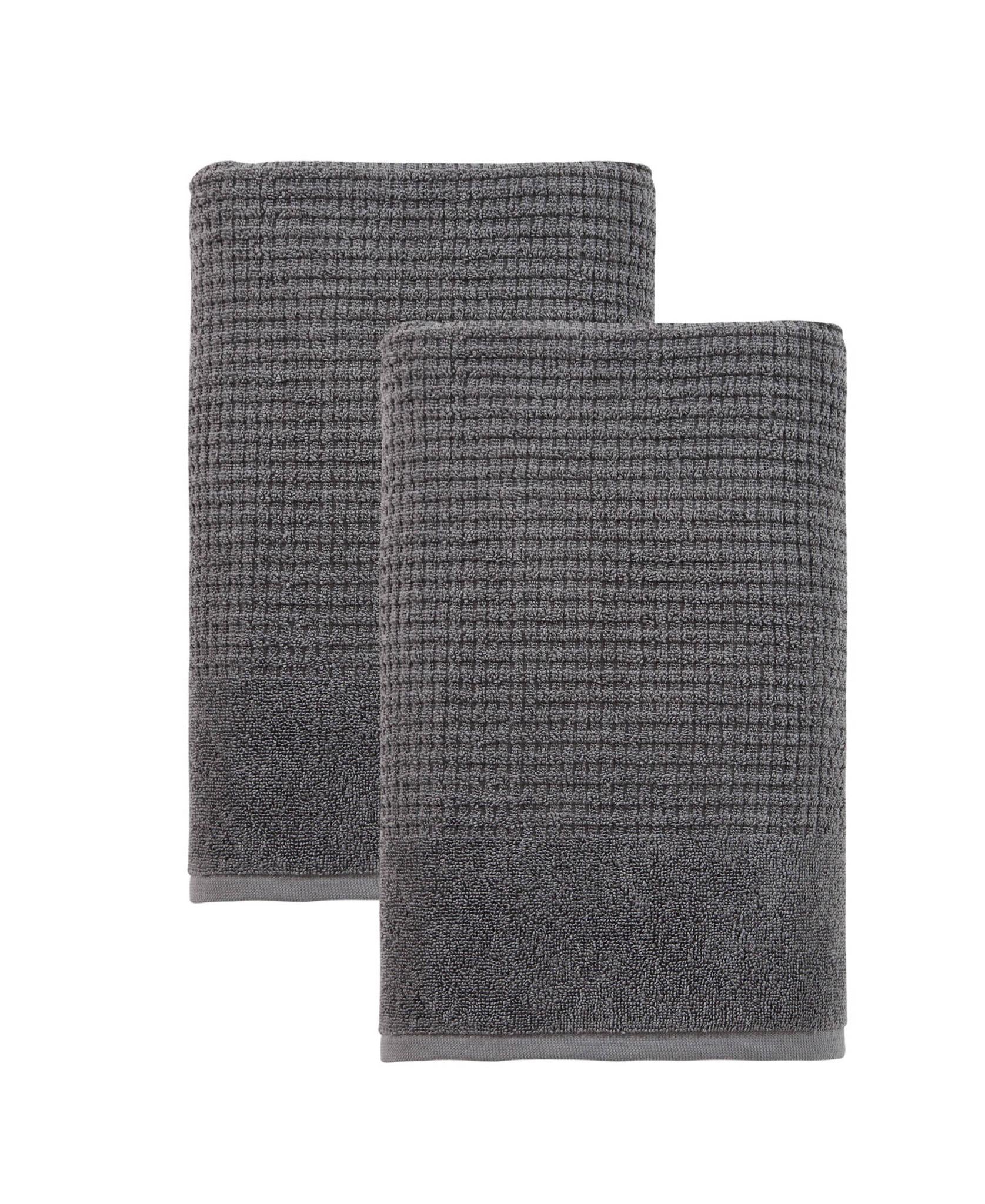 Set of two dark gray Turkish cotton bath towels, folded, waffle-textured weave.