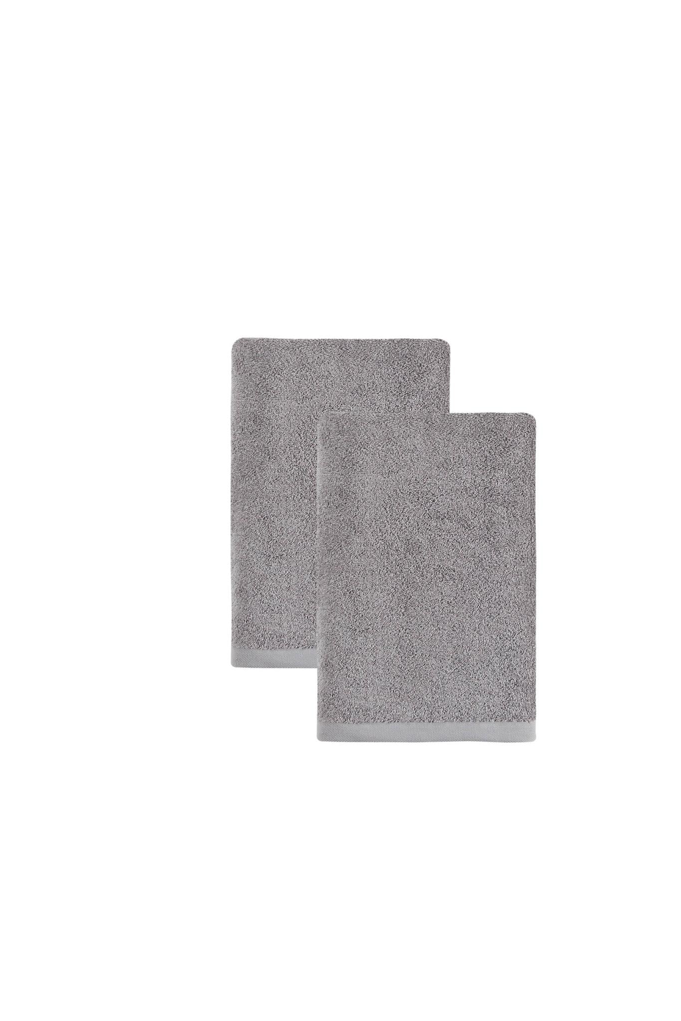 Set of two light gray Turkish cotton bath towels, stacked rectangular towels