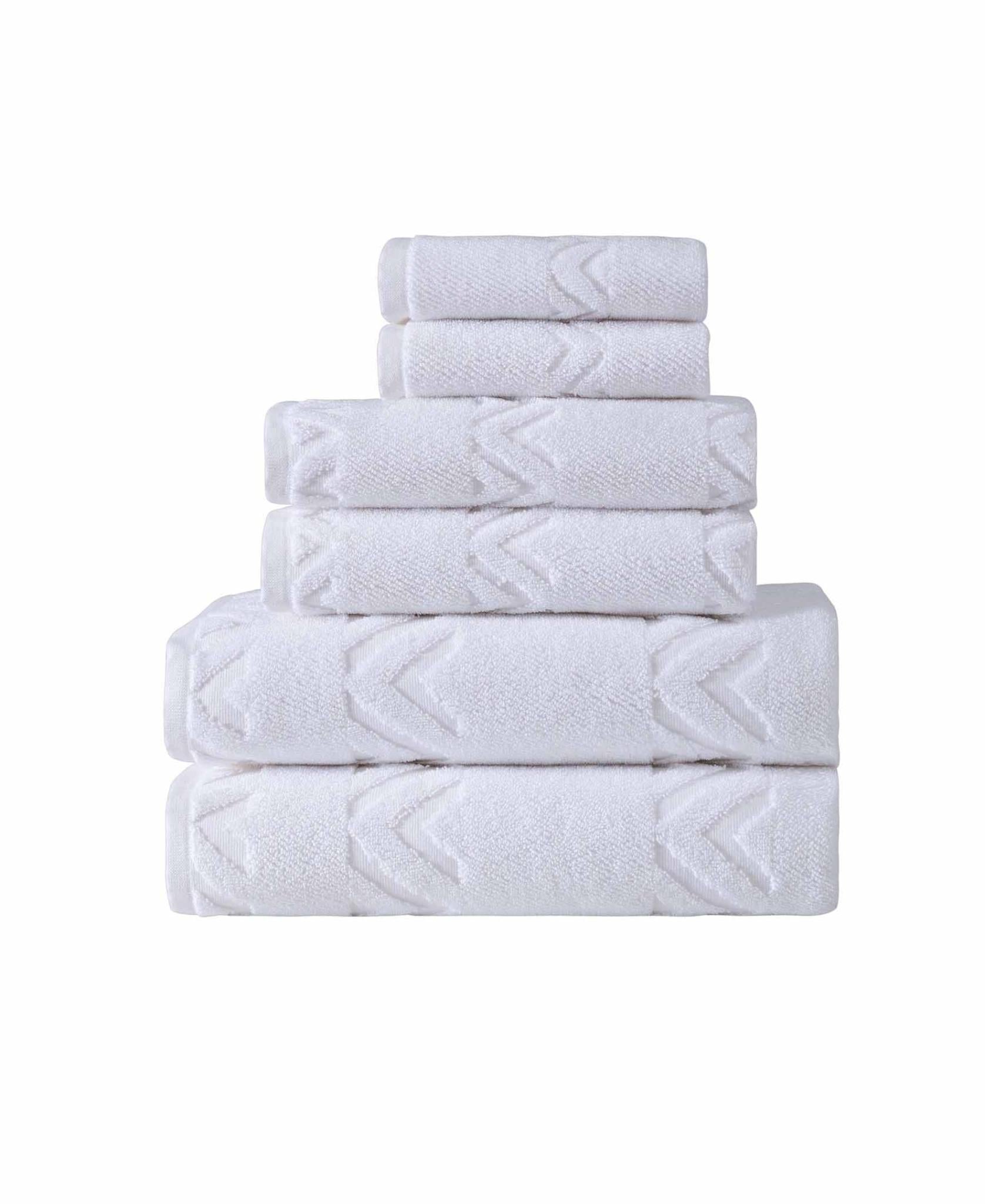 Set of six Turkish cotton towels, white geometric terry towels, neatly stacked
