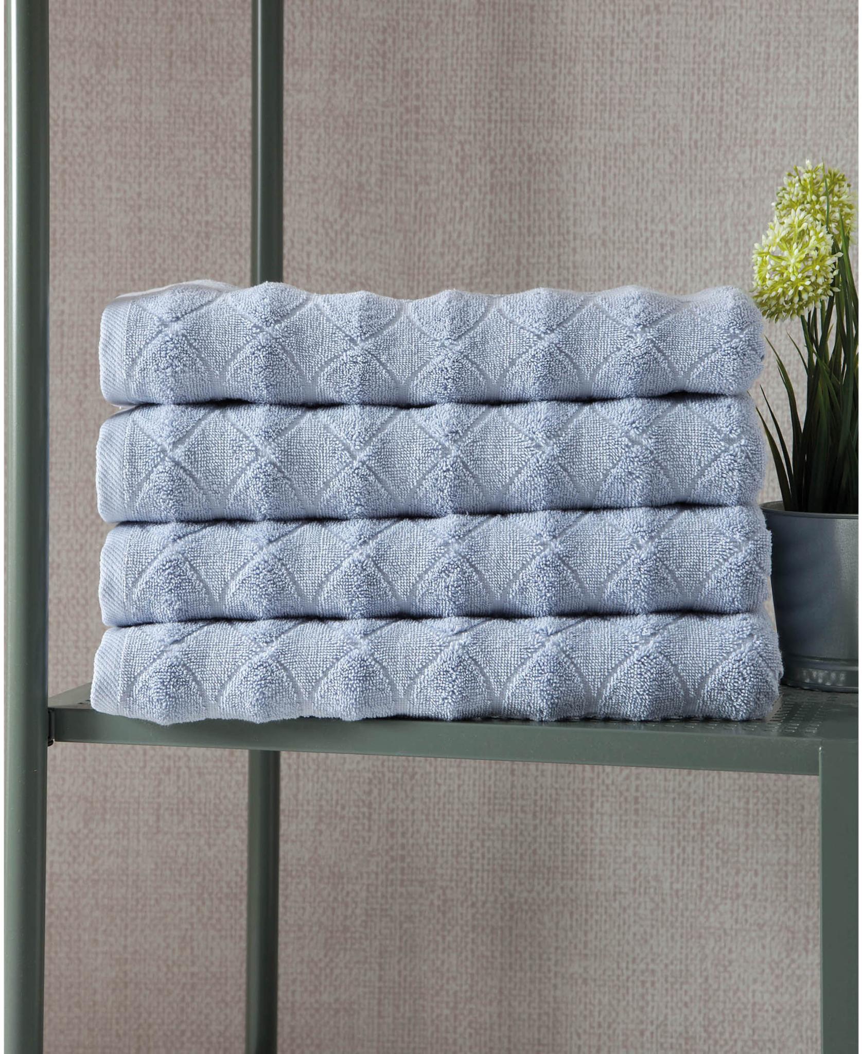 Blue geometric Turkish cotton bath towels, folded stack