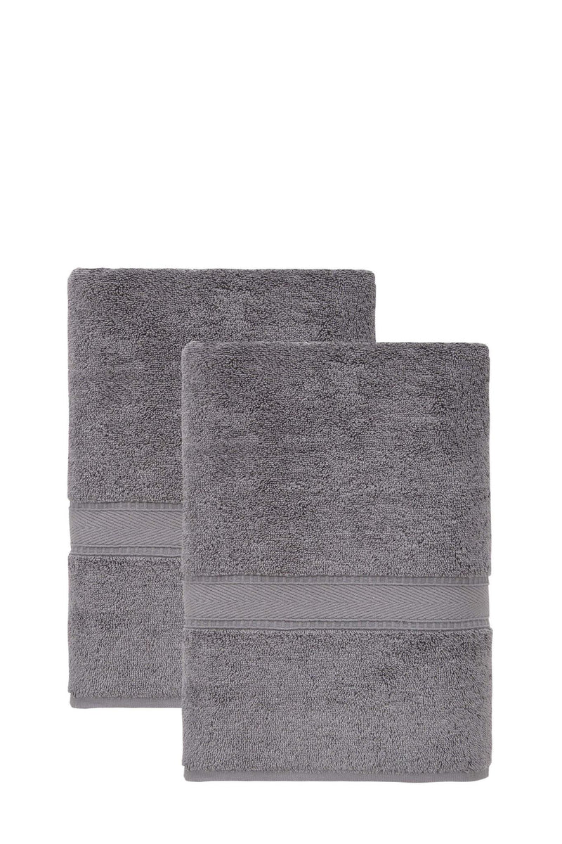 Set of two dark gray bath towels folded, matching border stripe