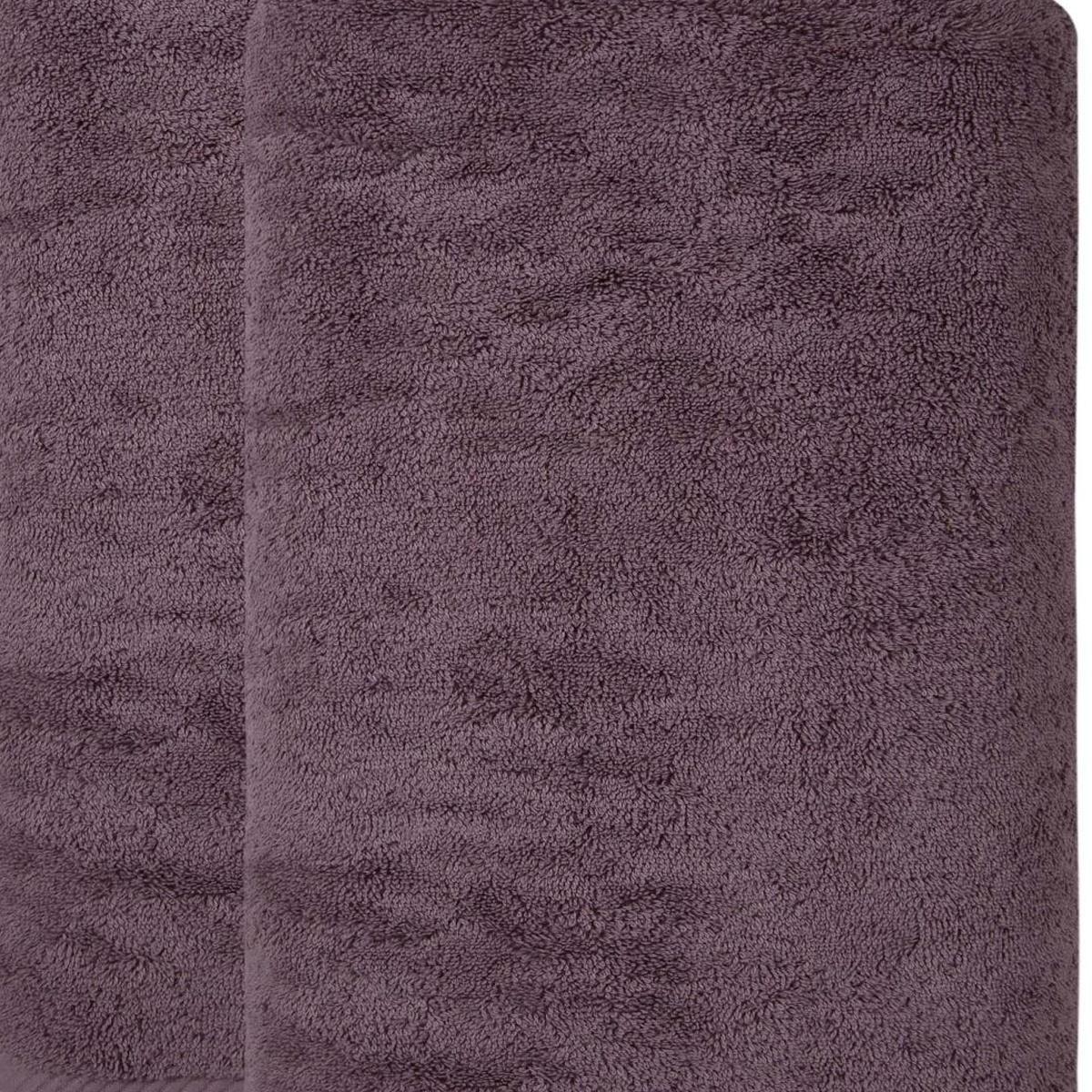 Purple Turkish cotton towel fabric close-up, plush looped texture