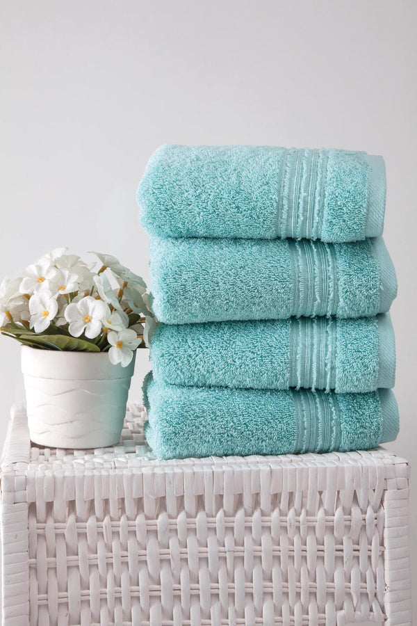 Stack of aqua Turkish cotton hand towels, 16x30 in, folded with textured loop weave