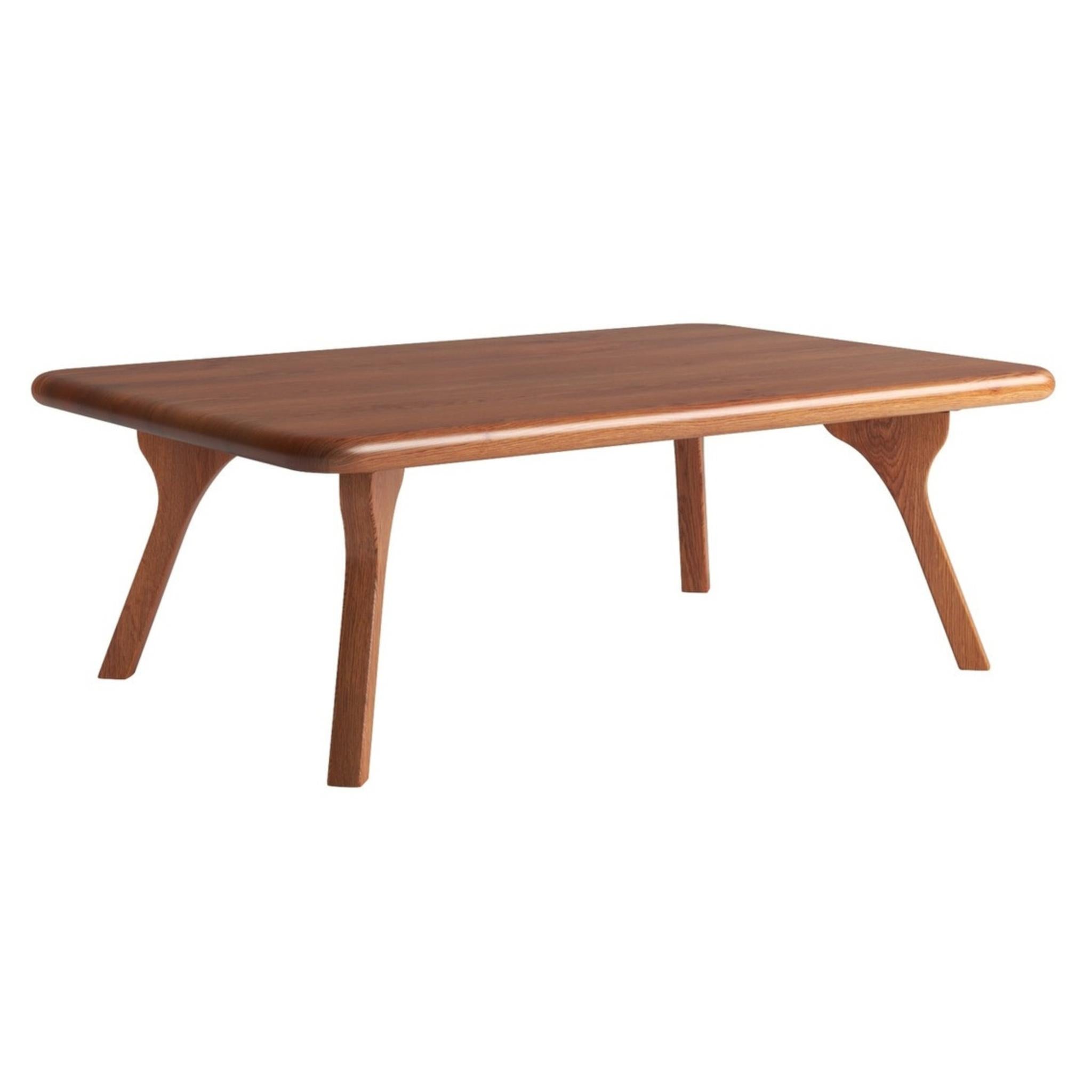 Walnut solid wood coffee table, low profile, rounded rectangular top and angled legs