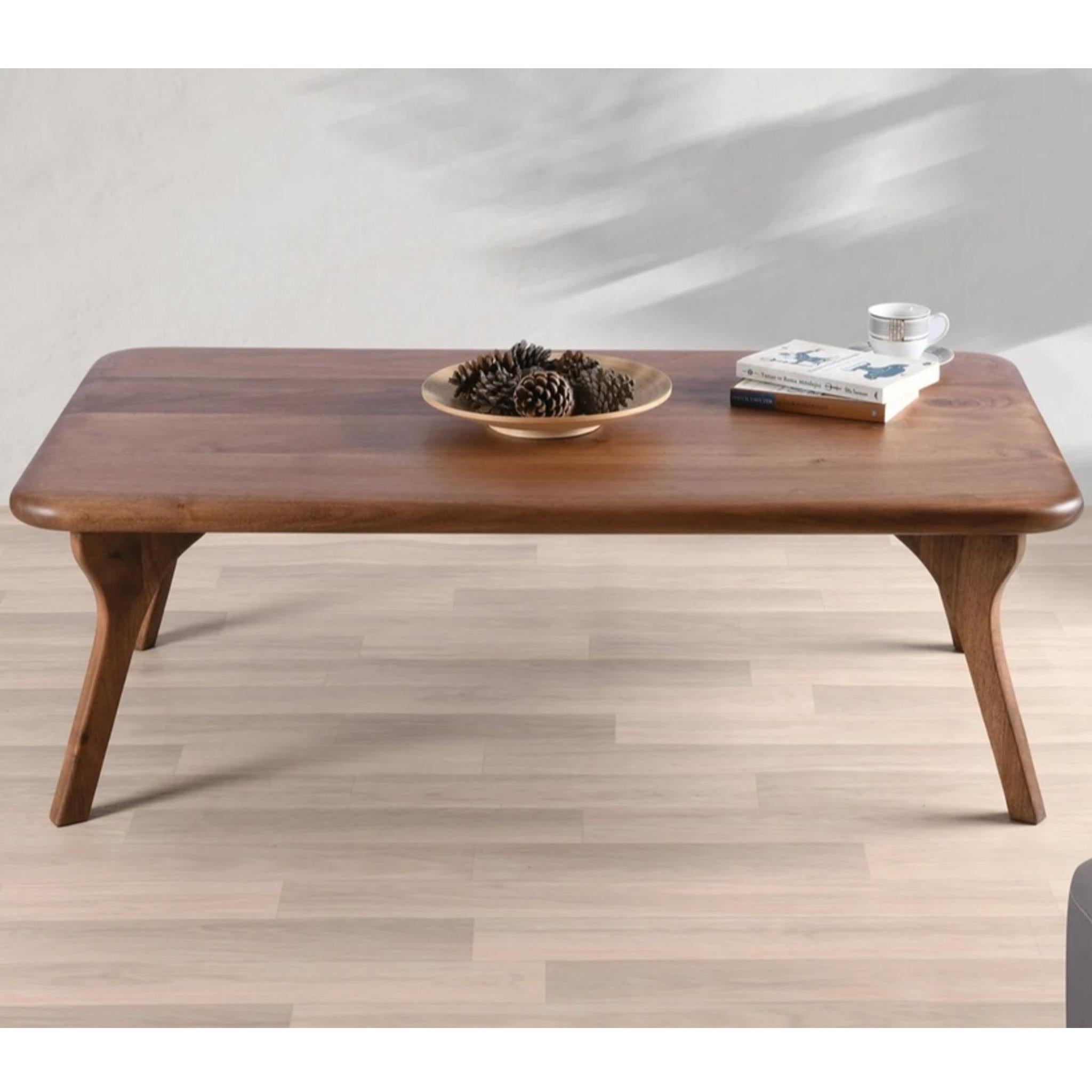 Walnut solid wood coffee table with smooth rounded edges and four angled legs