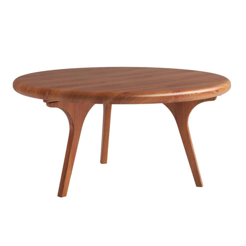 Walnut round coffee table with curved apron and four tapered legs