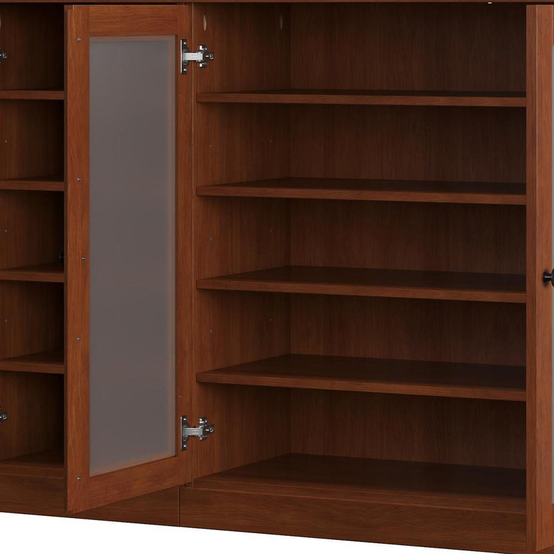 Solid wood shoe cabinet interior with fixed shelves behind the open left door