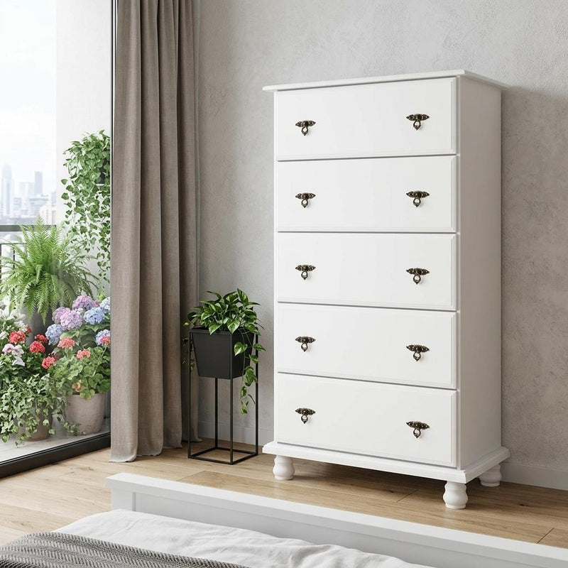 White solid wood five-drawer dresser with angled front view and dark metal knobs