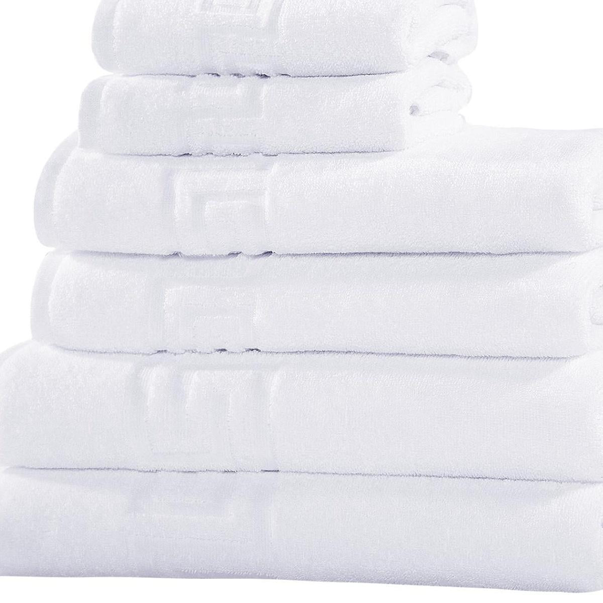 Stack of six white Turkish cotton towels, folded in neat layers
