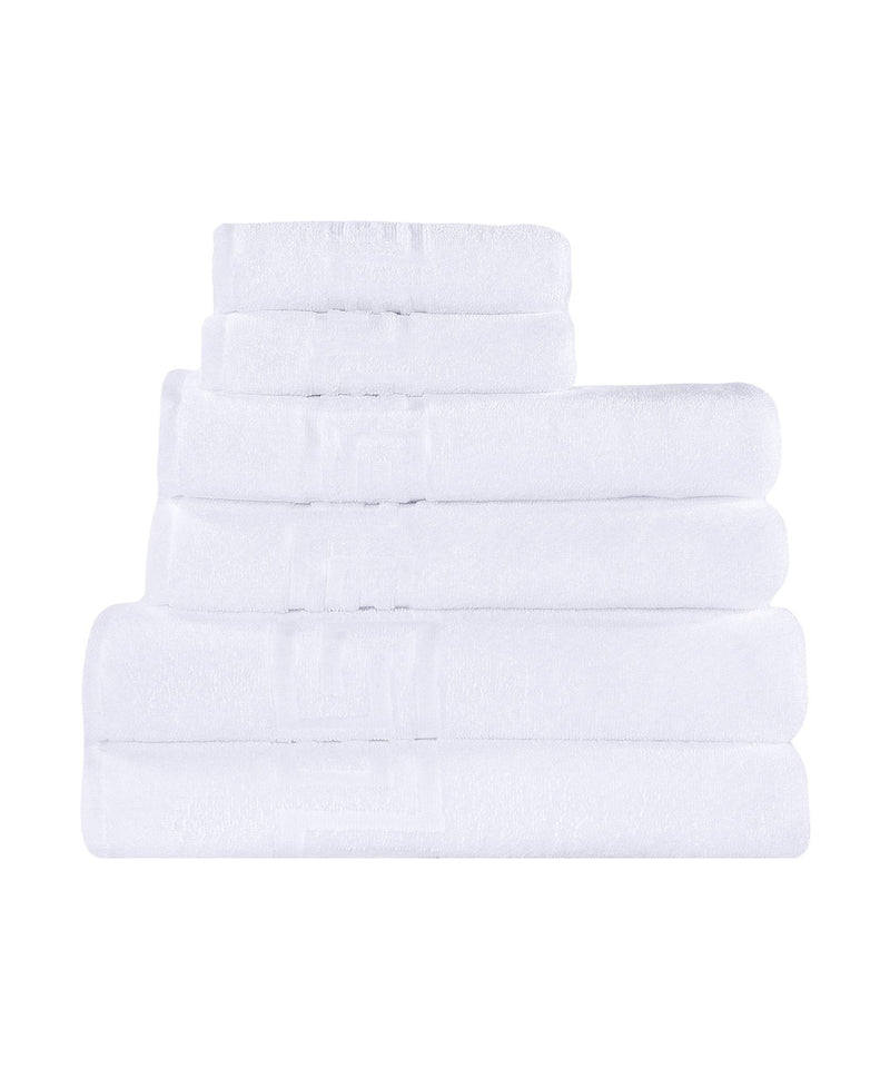 Set of six white Turkish cotton towels, neatly folded stack