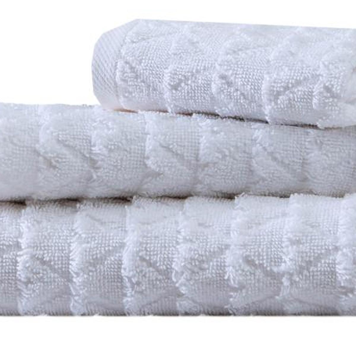 White Turkish cotton towel set with geometric jacquard weave, folded stack