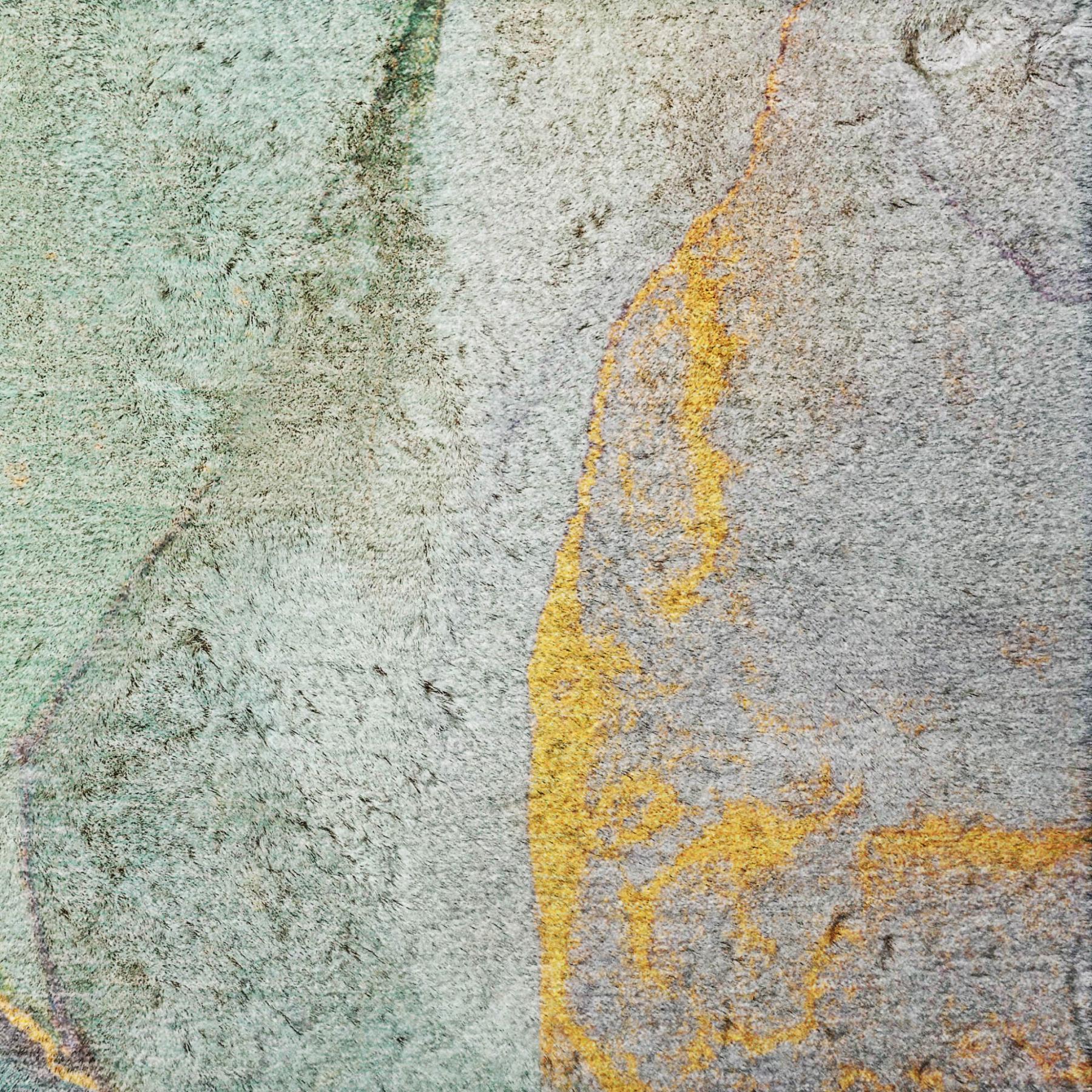 Teal and gray abstract shag rug close-up with orange and yellow highlights