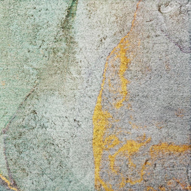 Teal and gray abstract shag rug close-up with orange and yellow highlights