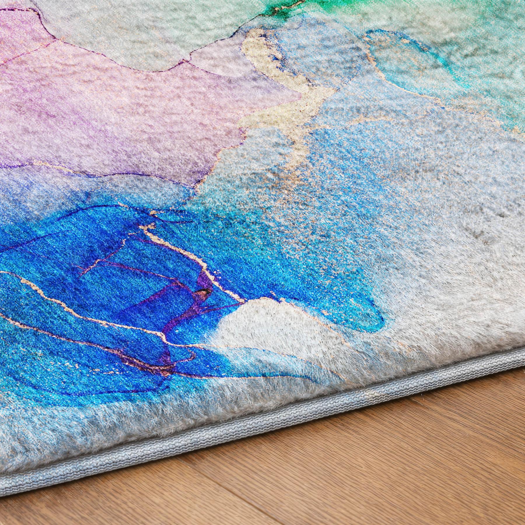 Abstract shag area rug with blue, teal, purple, and gray textured pattern and gray border