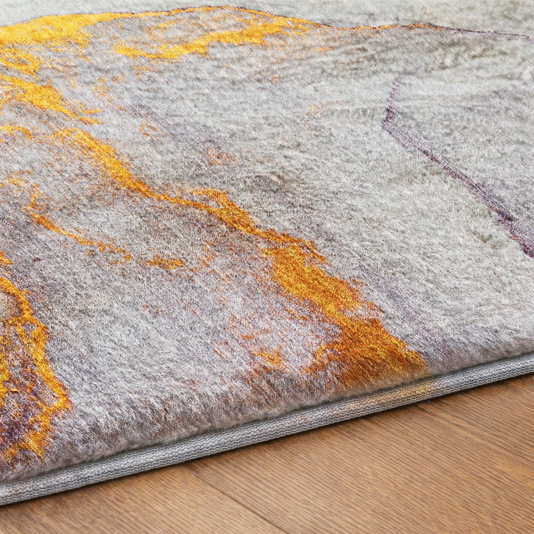 Abstract shag area rug with light gray base, teal and mustard orange accents