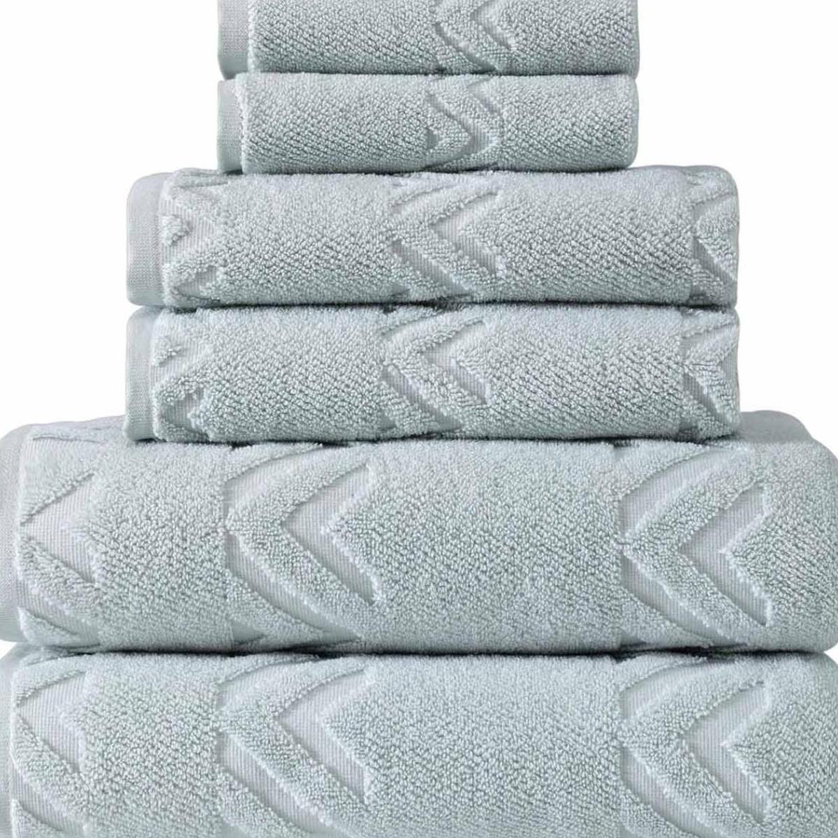Aqua Turkish cotton towels stacked, close-up chevron geometric embroidery
