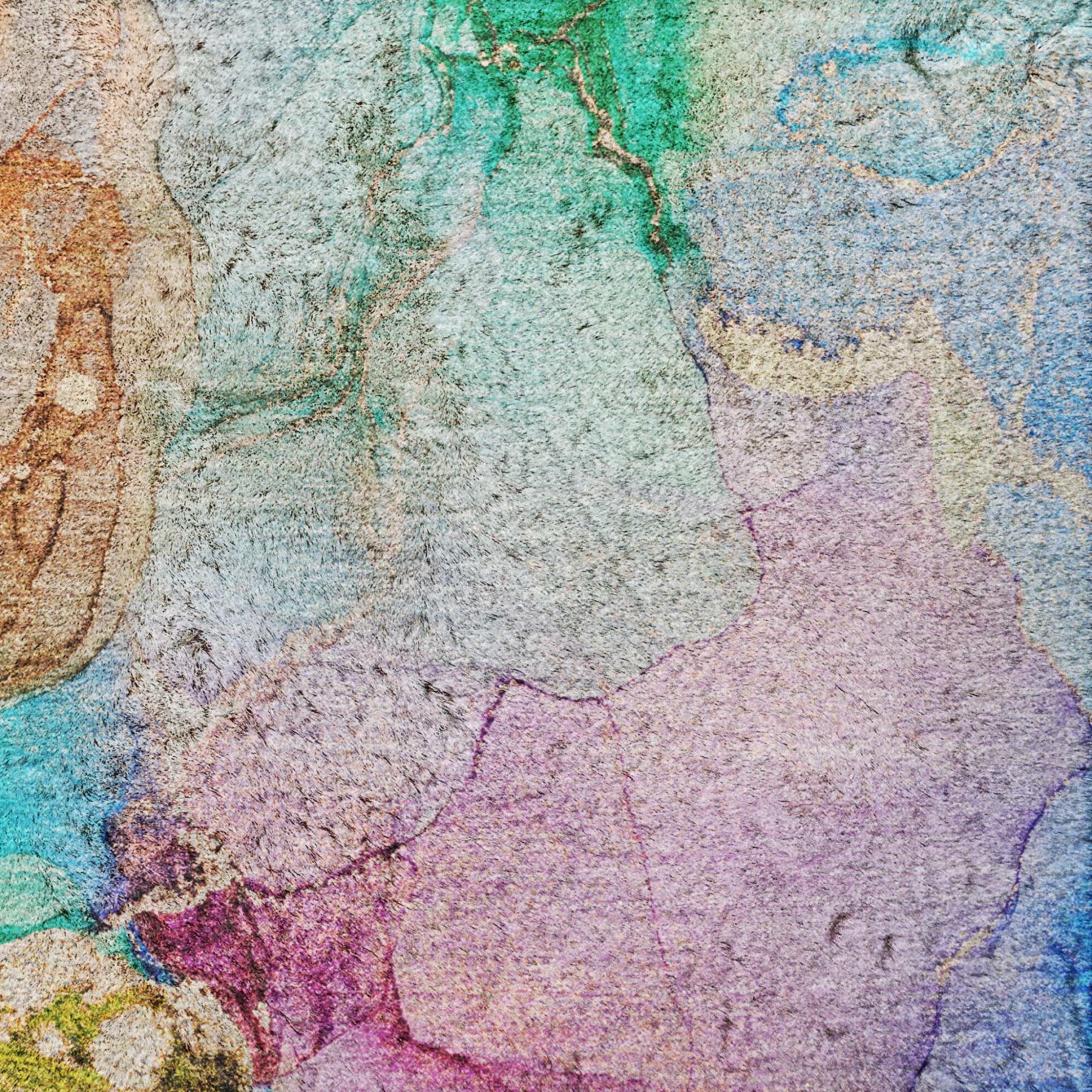 Multicolor abstract shag area rug surface with soft, low pile texture.