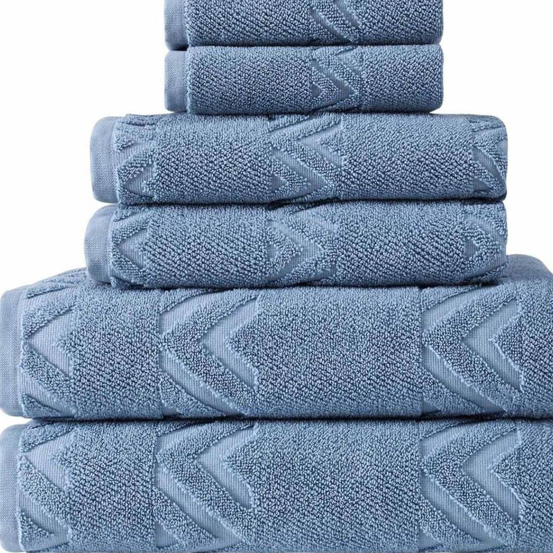 Close-up of blue textured towels with geometric chevron pattern