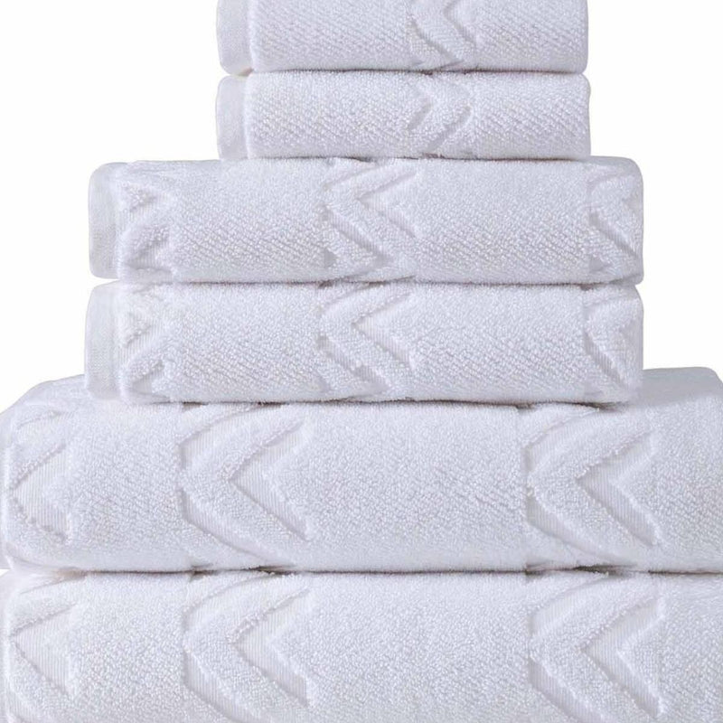 Set of six Turkish cotton towels, white with geometric chevron pattern, stacked