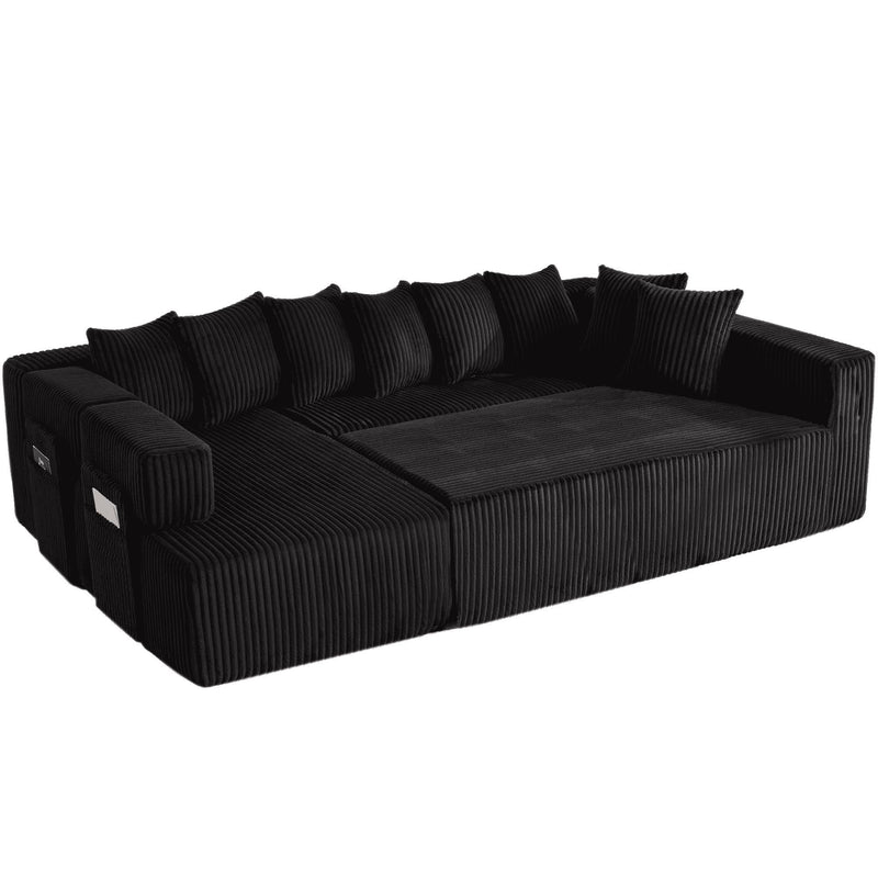 Dark corduroy sectional sofa with wide ottoman-style corner chaise and throw pillows