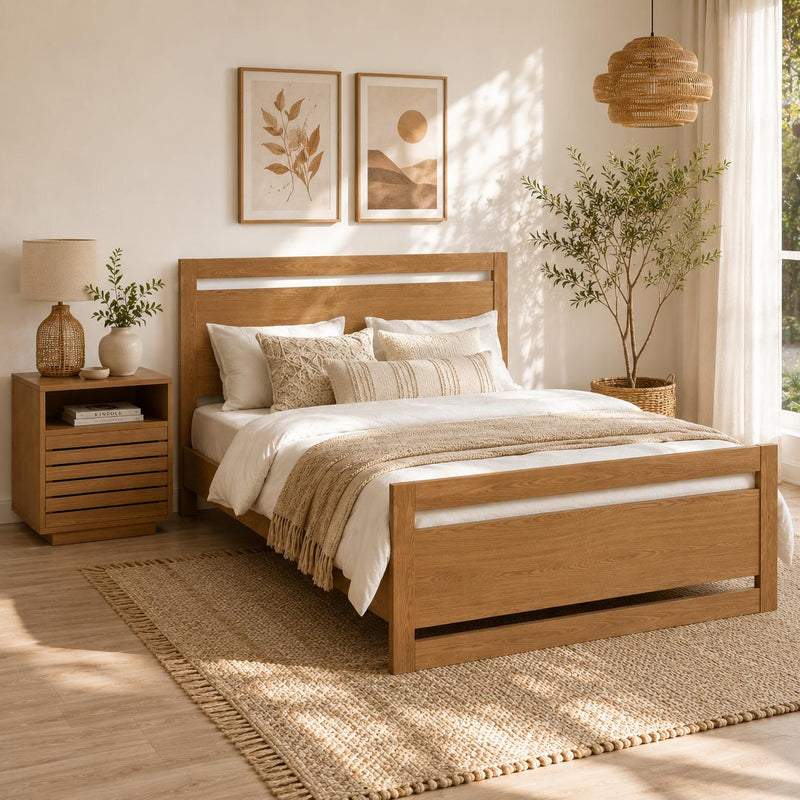 Natural wood nightstand with shutter-style drawer fronts and open shelf, next to bed