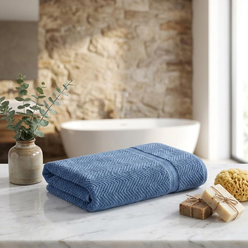 Set of two navy chevron bath sheets, folded Turkish cotton towels