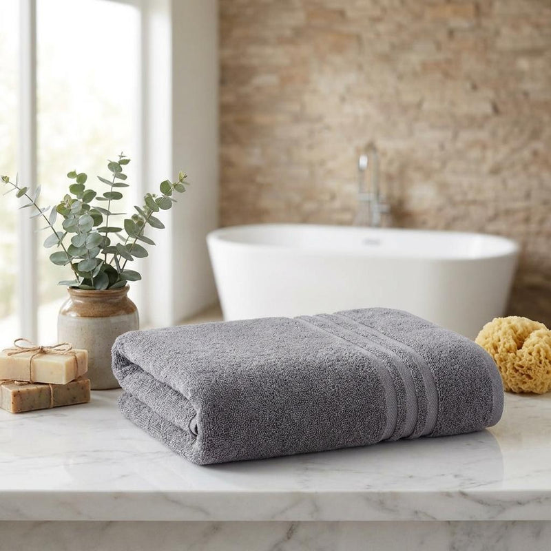 Folded dark gray bath towels with striped bands, set of two
