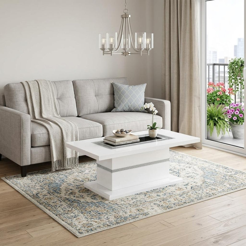 White pedestal coffee table with gray faux crystal top insert in living room