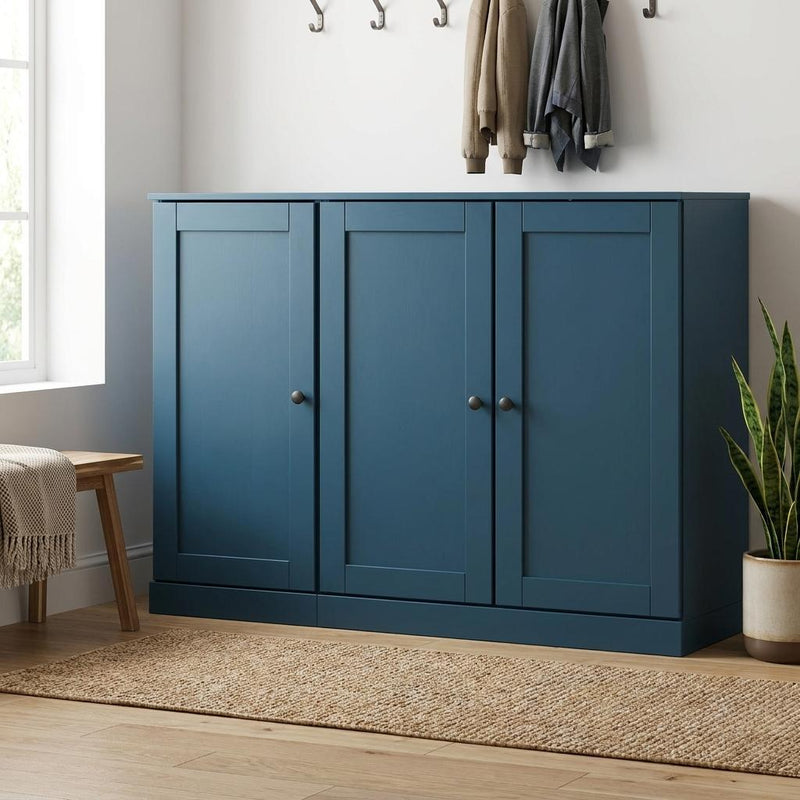 Teal blue wood shoe storage cabinet with three doors and brushed metal knob handles