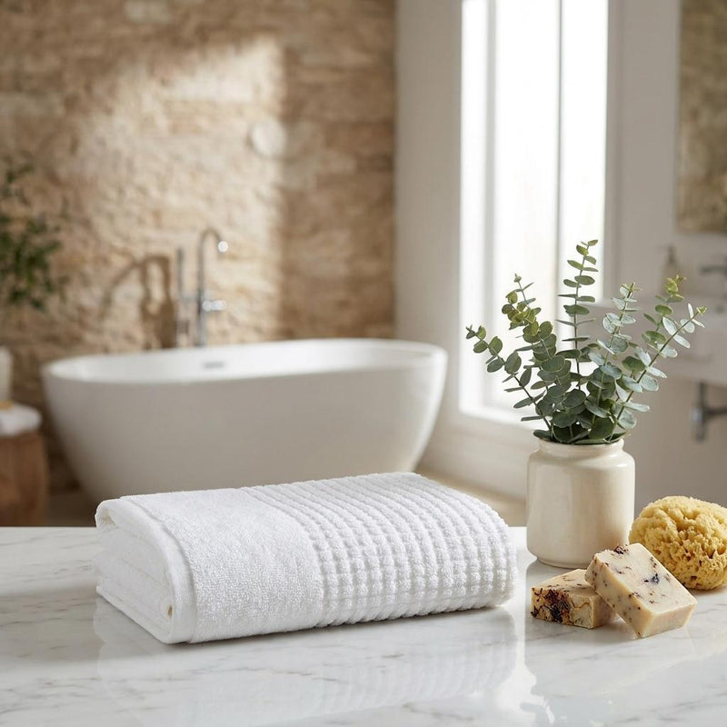 White Turkish cotton hand towel pair with waffle texture, folded on a flat surface