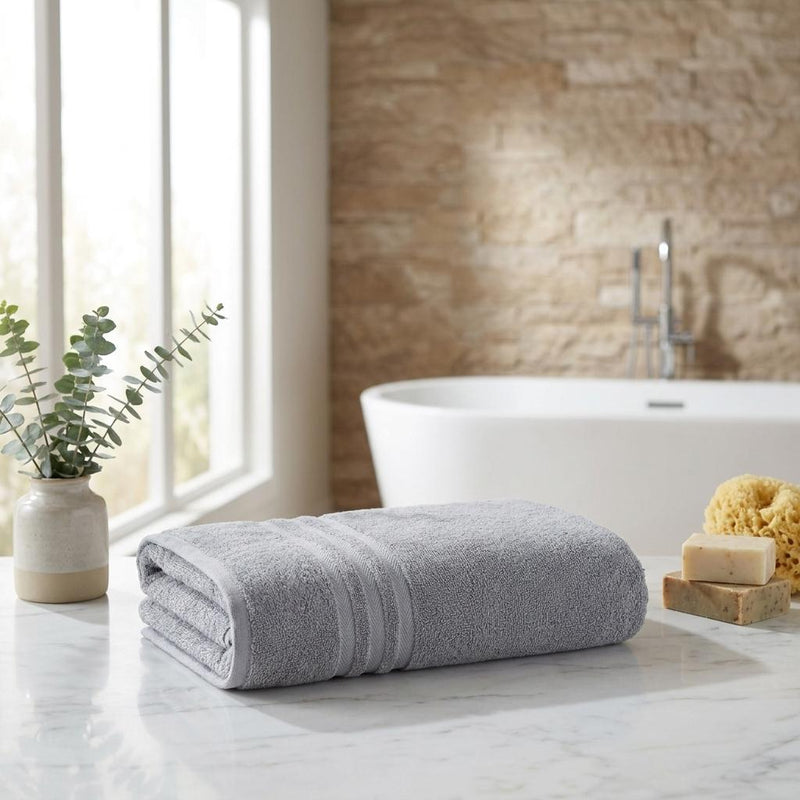 Light gray bath towel set of two, folded with horizontal striped bands.