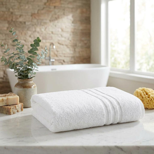 Set of two light bath towels, folded with plush terry loops, 27x54 in each