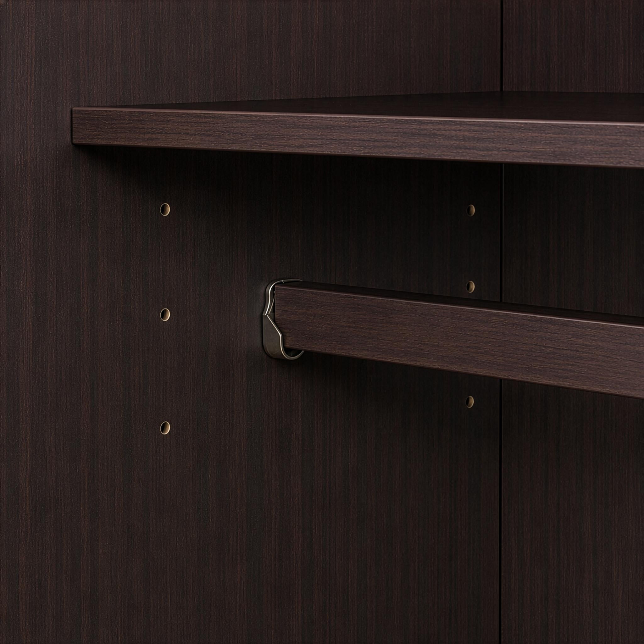 Dark brown solid wood dresser front with multiple doors and round knobs