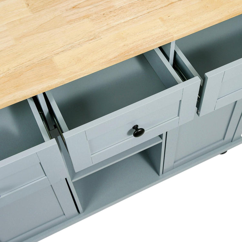 Kitchen cart drawer and cabinet interior with black knob pulls, light wood top frame