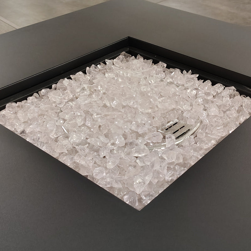 Reflective fire pit glass crystals filling a square fire pit tray
