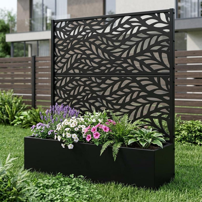 Two black metal rectangular planter boxes with botanical leaf panel and planted flowers