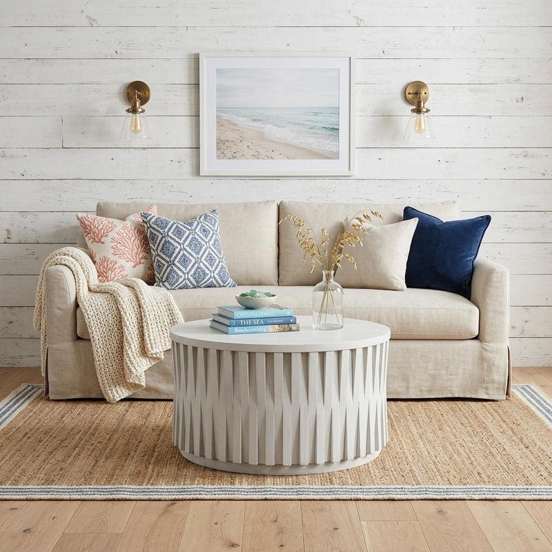 White round drum wood coffee table with fluted vertical side panels