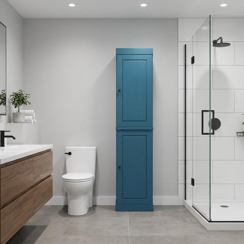 Teal blue tall freestanding linen cabinet with double paneled doors and knobs.