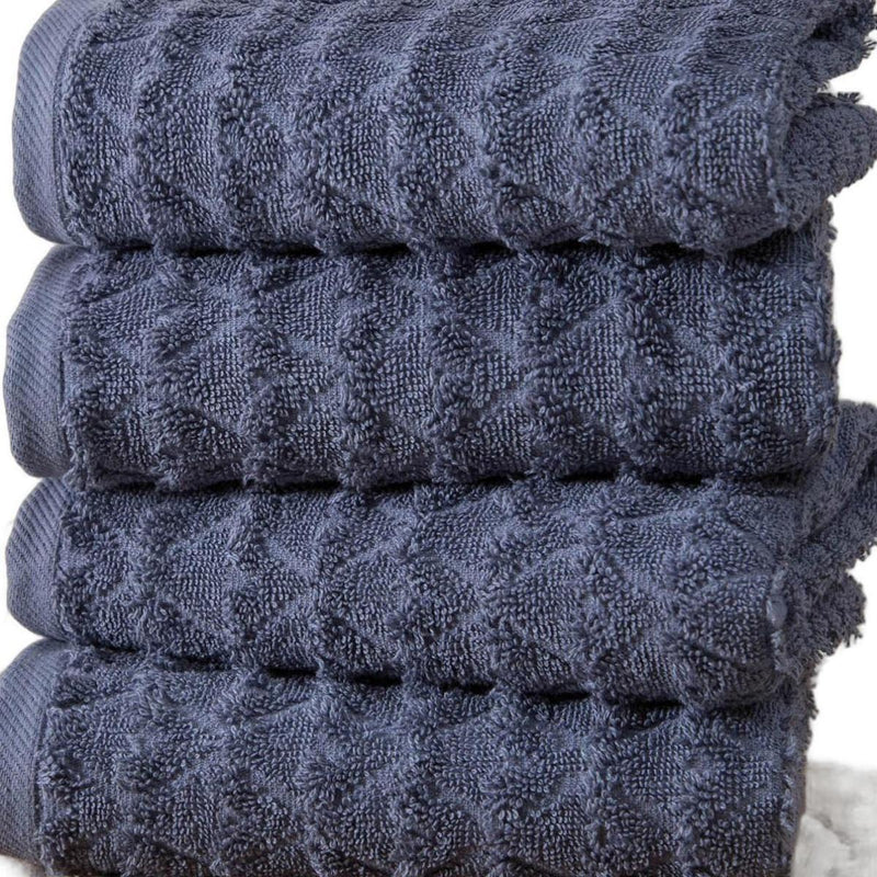 Navy geometric Turkish cotton hand towels, folded stack with stitched bands