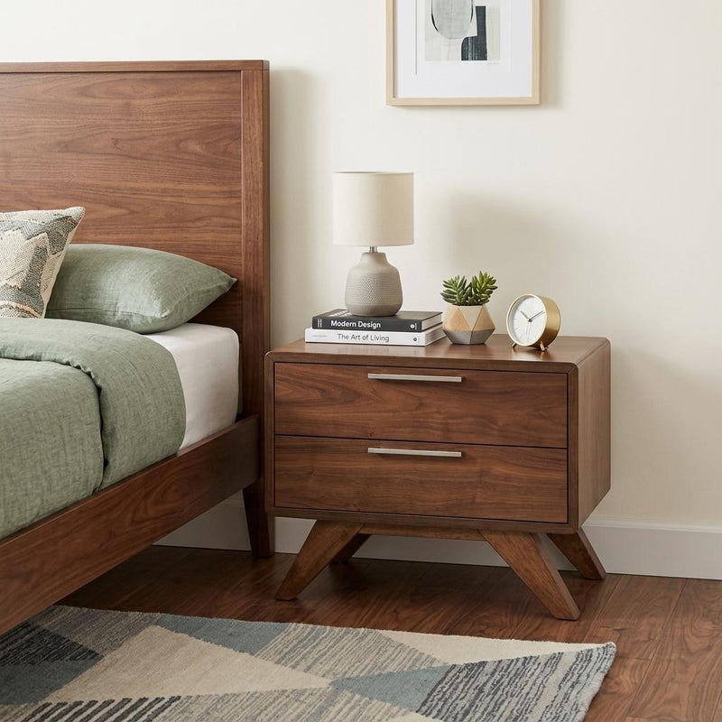 Walnut-toned two-drawer nightstand on angled wooden legs with silver bar handles