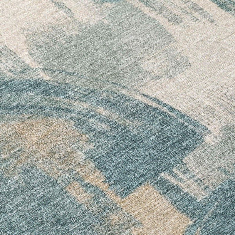 Teal and cream abstract rug with faded brushstroke lines