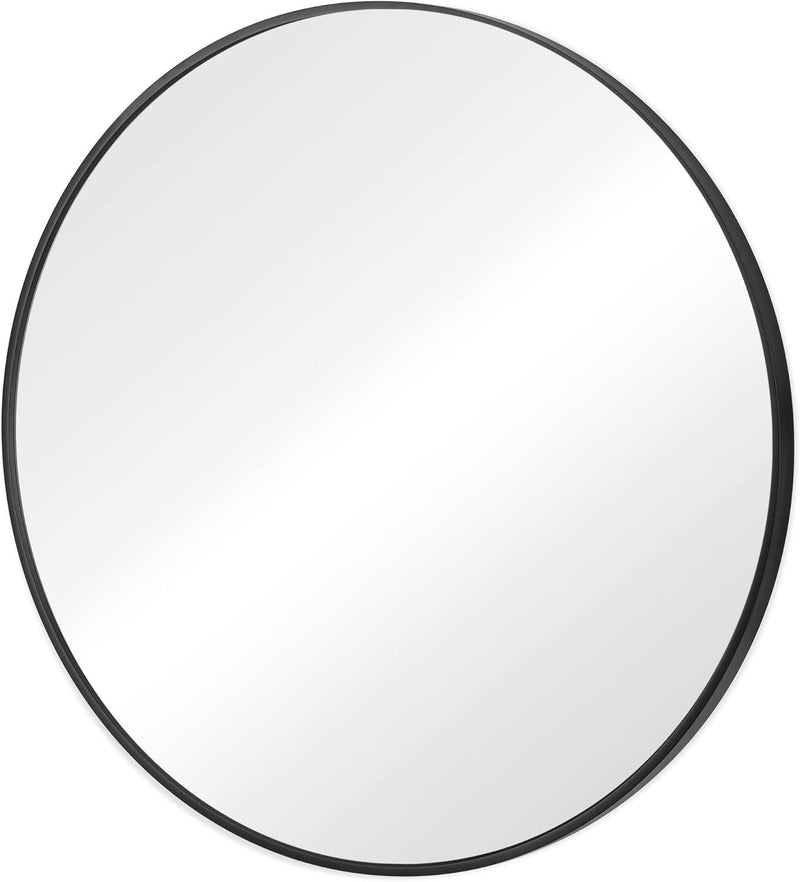 Round mirror with black metal frame and reflective glass