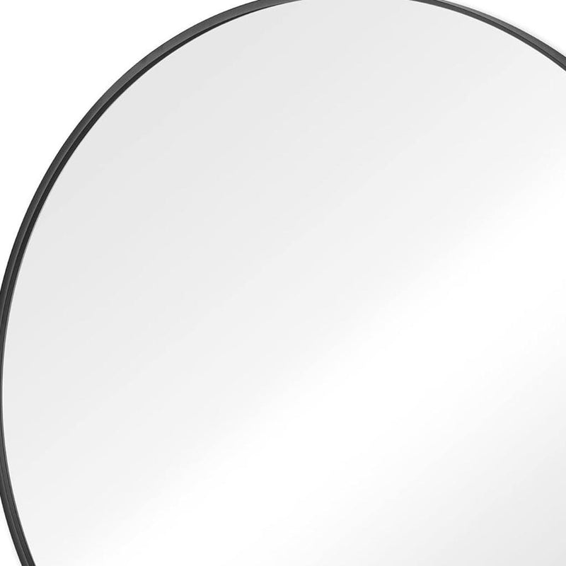 Round mirror close-up with black metal frame edge