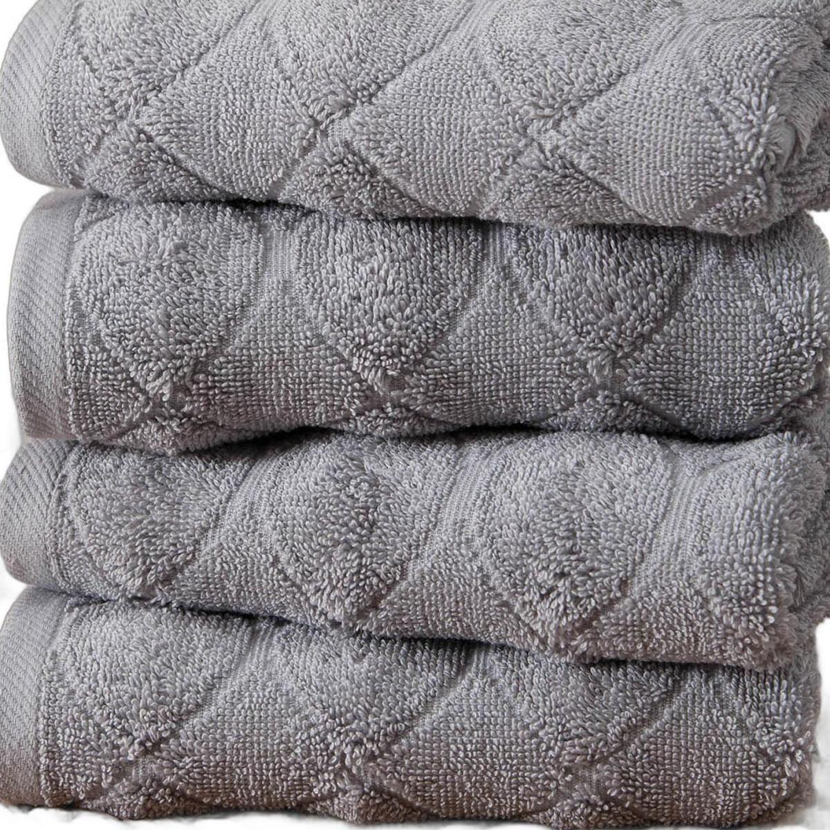 Set of four gray geometric Turkish cotton hand towels, folded with textured pattern